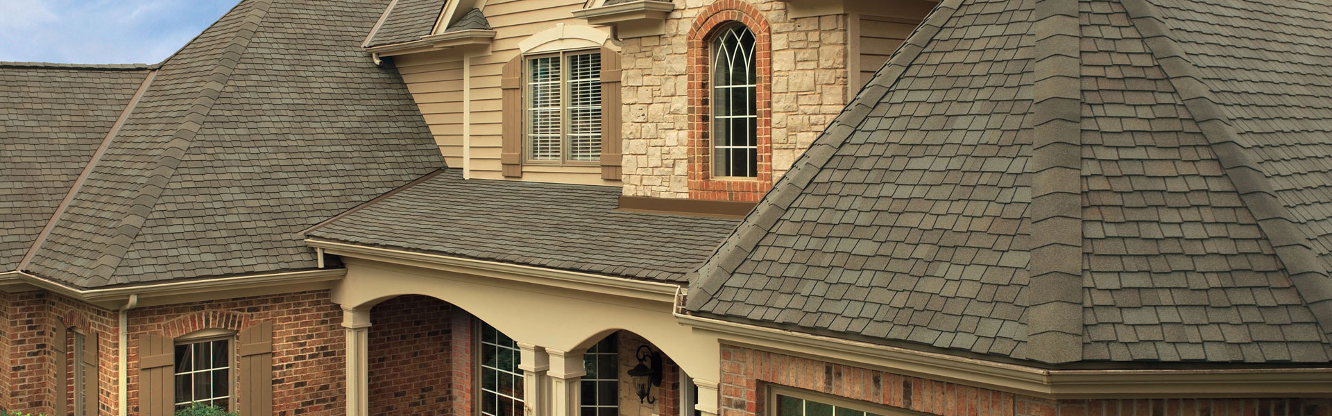Home with a brown shingle roof